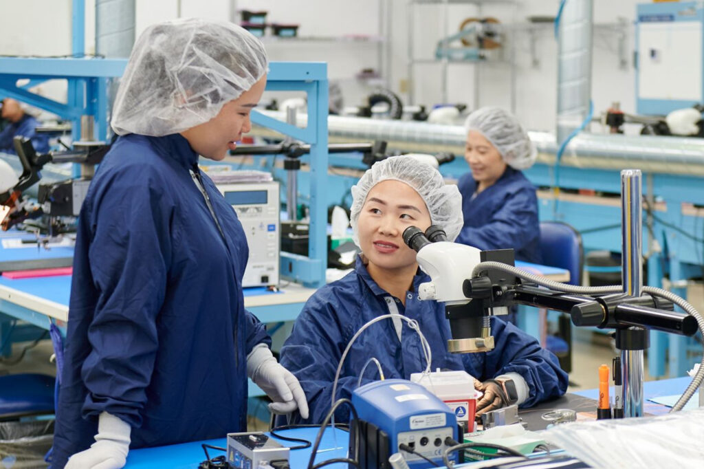 Two women testing medical devices